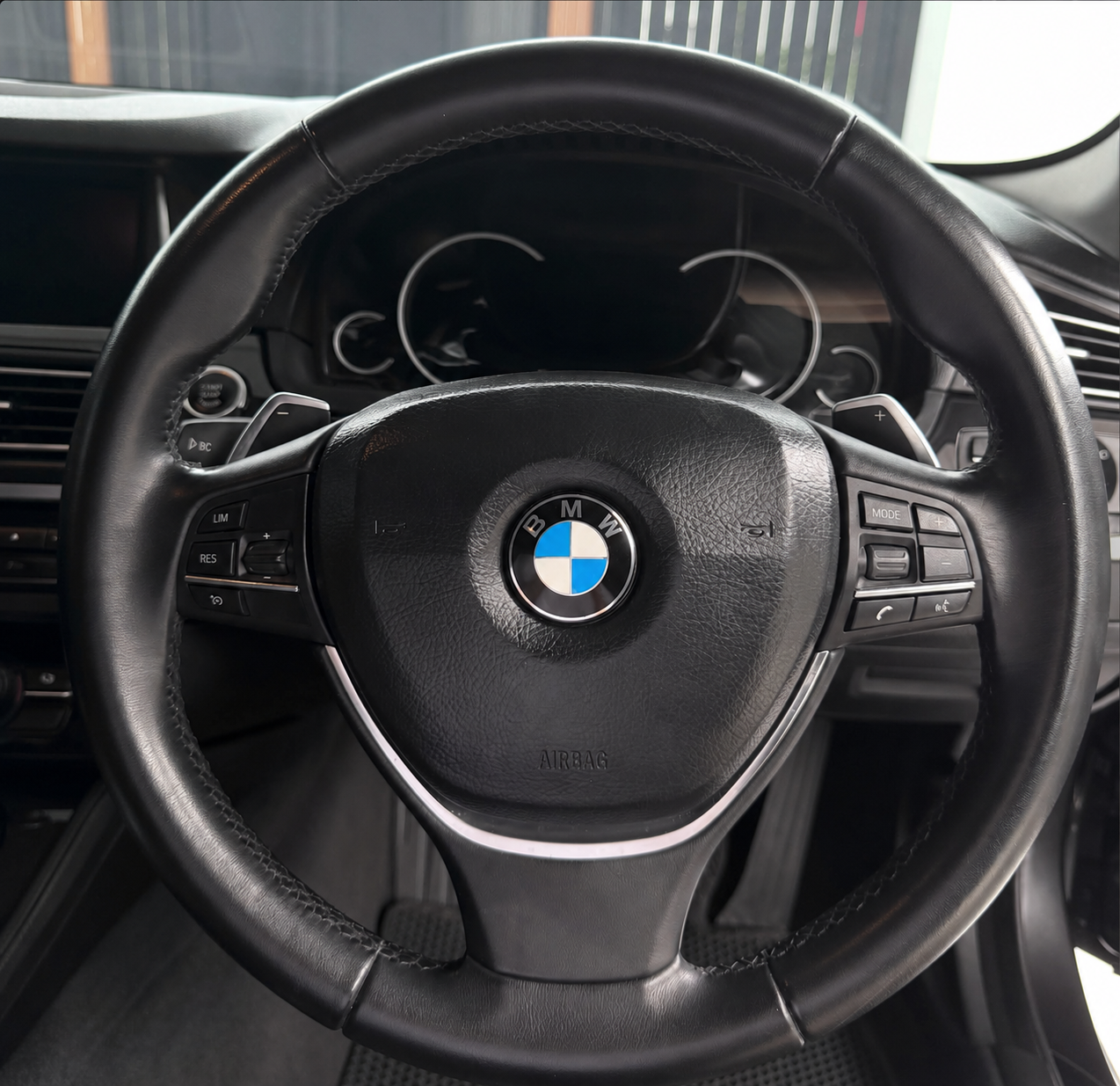 Before — Stock steering wheel
